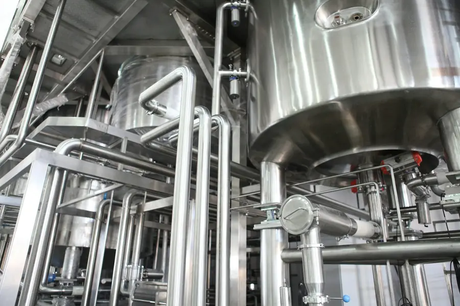 Close-up of stainless steel vessels and process piping