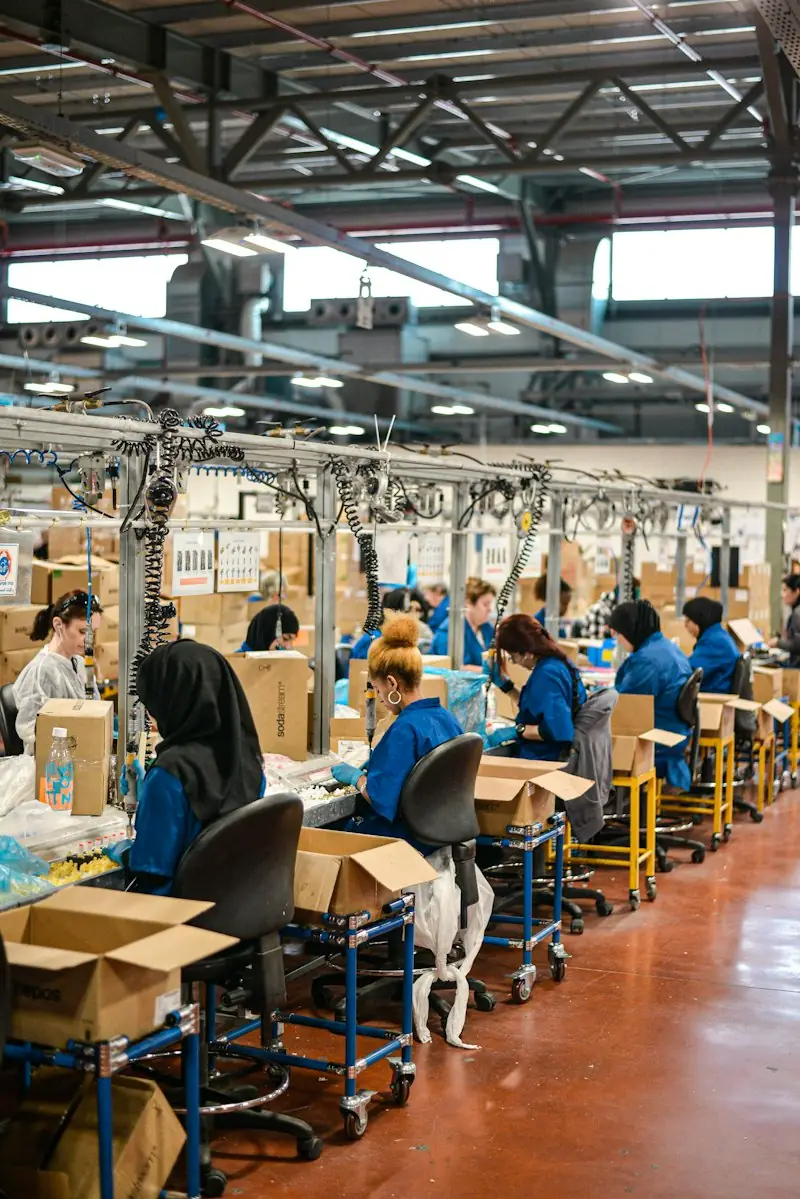 Workers at an assembly line in a factory