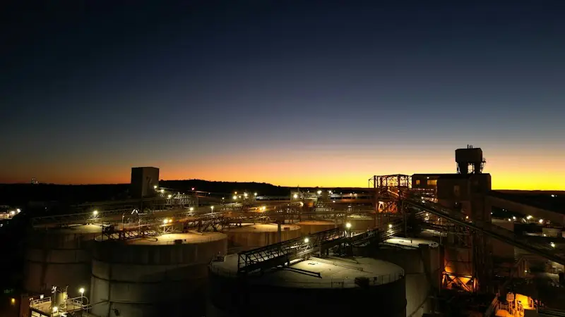 Petrochemical plant lit up at dusk