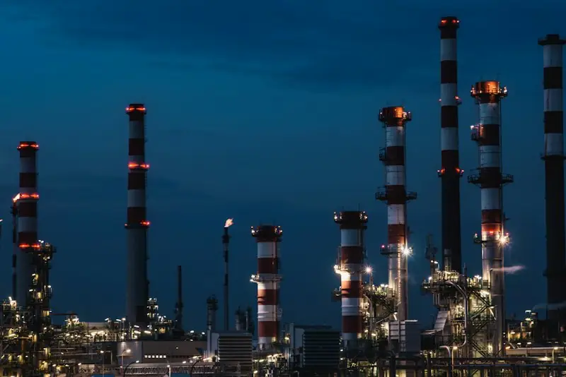 Power plant stacks against a night sky