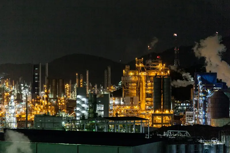 Refinery glowing with lights at night
